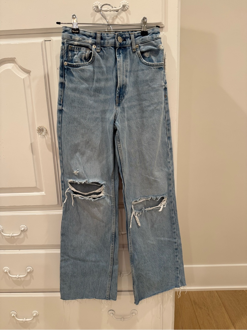 High waisted jeans with rips in knees